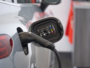 electrical vehicle being charged by an EV charger whilst in a garage