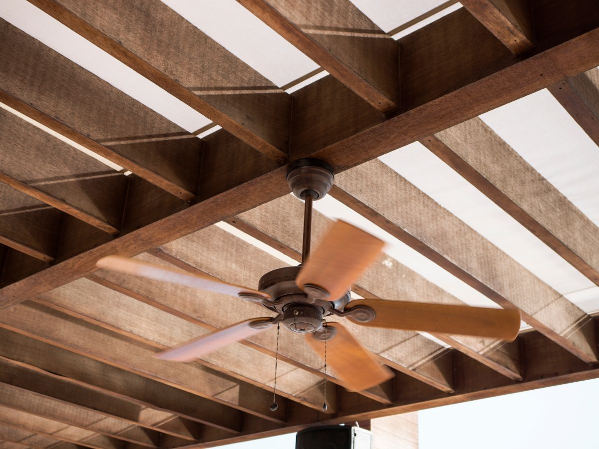 ceiling fan that has been install on a timber joist